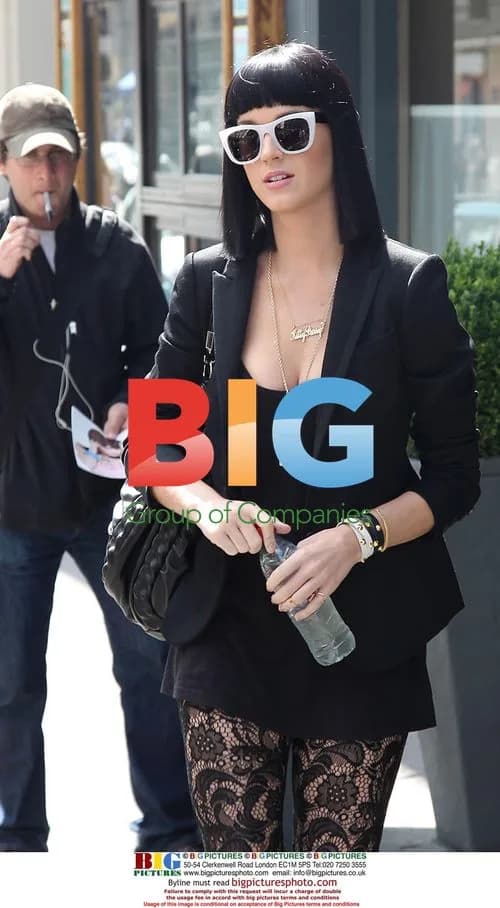 Katy Perry leaves Paris hotel with father