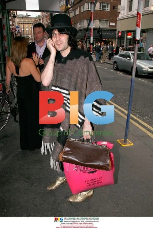 Noel Fielding in Bowler Hat and Poncho