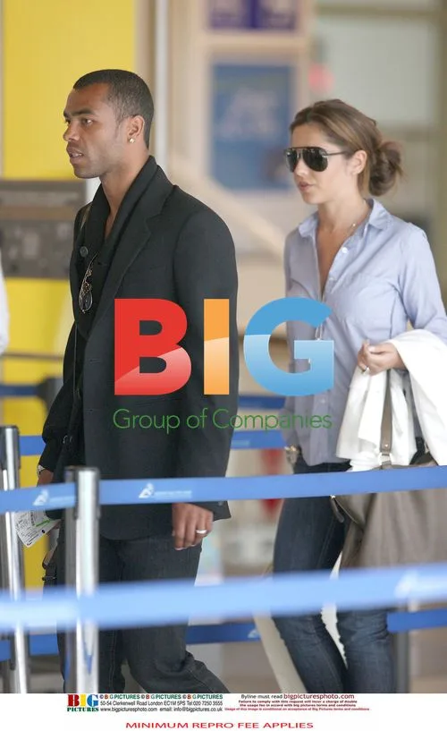 Cheryl and Ashley Cole at Airport
