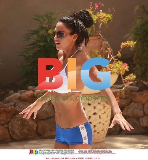 Katie Price Relaxes in Ibiza Pool