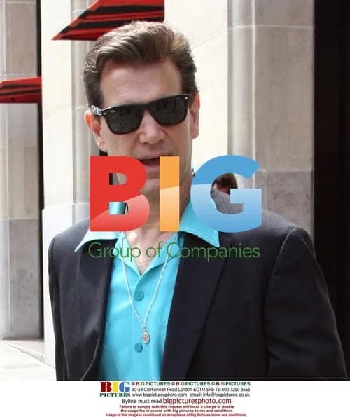 Chris Isaak leaves hotel in Paris