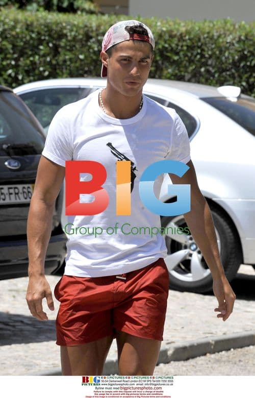 Cristiano Ronaldo greets press outside Algarve villa