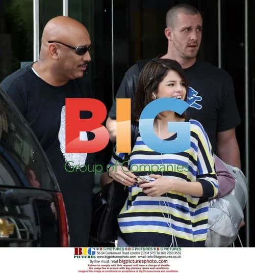 Selena Gomez departs hotel with step-dad