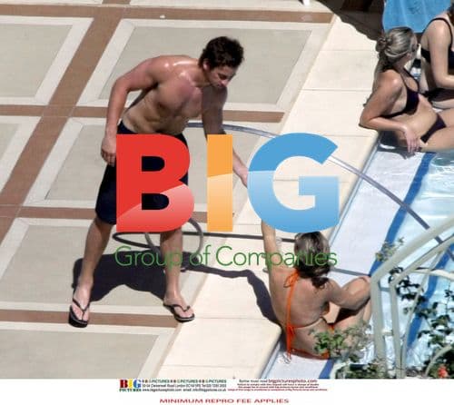 Kelly Brook and Danny Cipriani Poolside