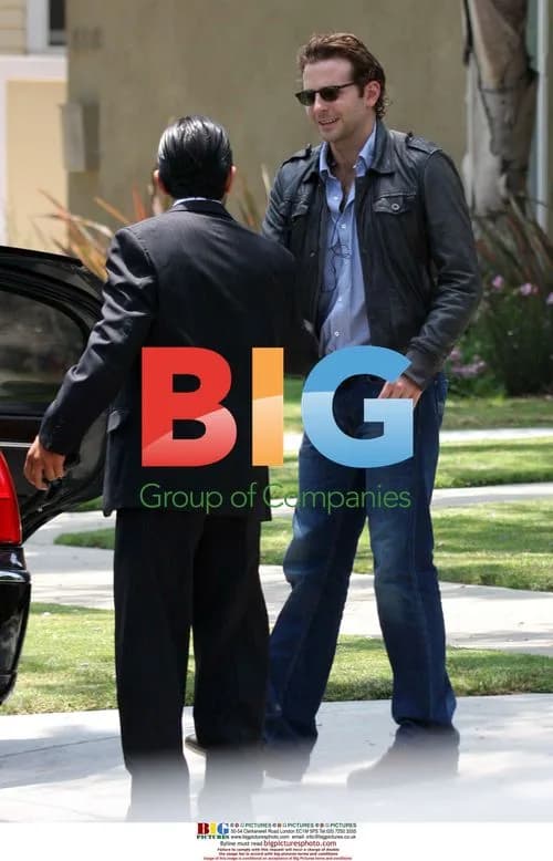 Bradley Cooper putting car cover on before airport
