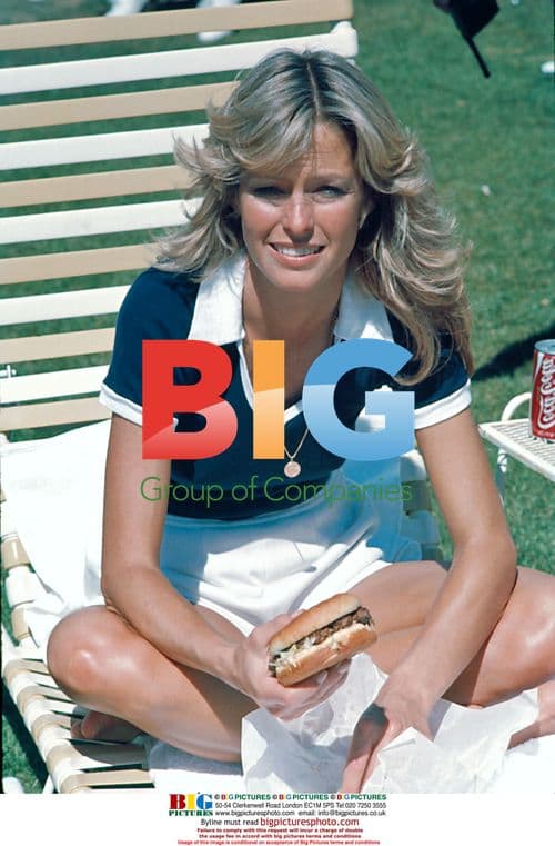 Farrah Fawcett eating a burger on a break