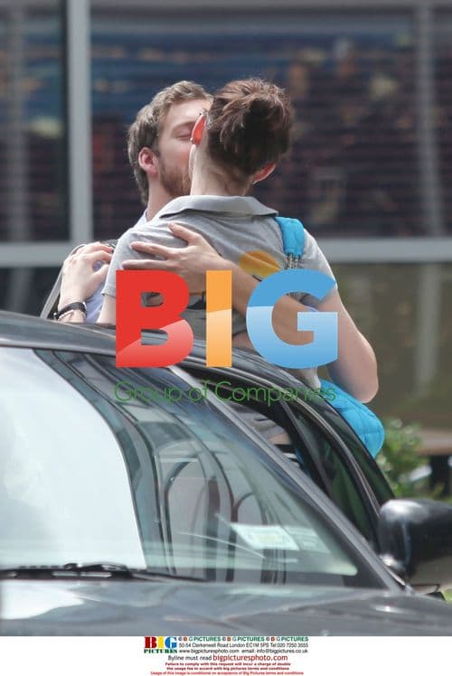 Anne Hathaway kisses boyfriend goodbye