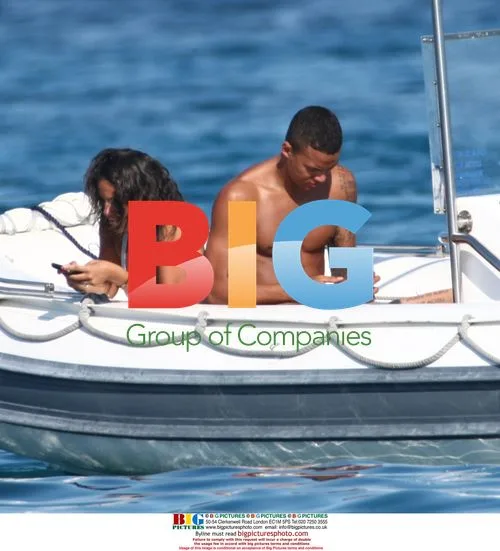 Footballer Jermain Jenas and girlfriend on boat in Italy