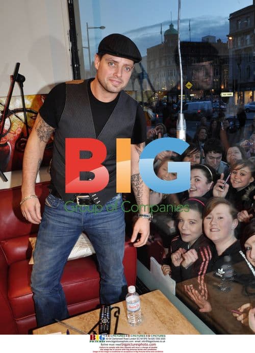 Keith Duffy poses with swimmer and radio DJs