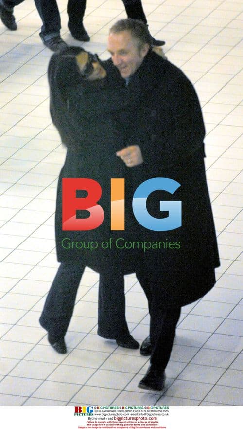 Pinault and Hayek's Affectionate Airport Reunion