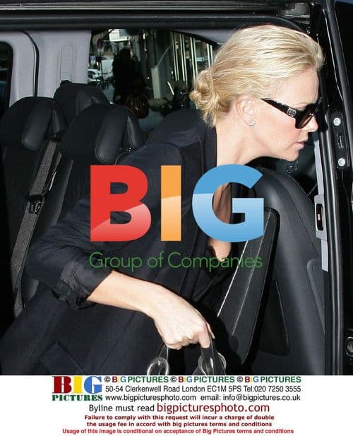 Charlize Theron shops in Paris