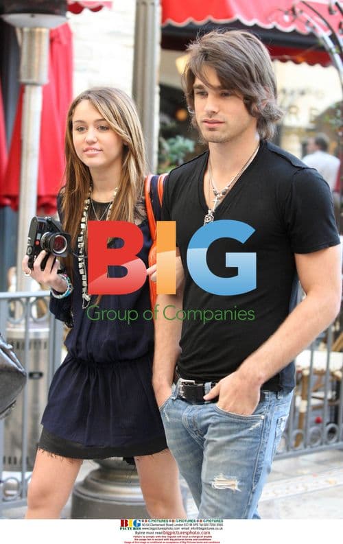 Miley Cyrus and Justin Gaston at The Grove
