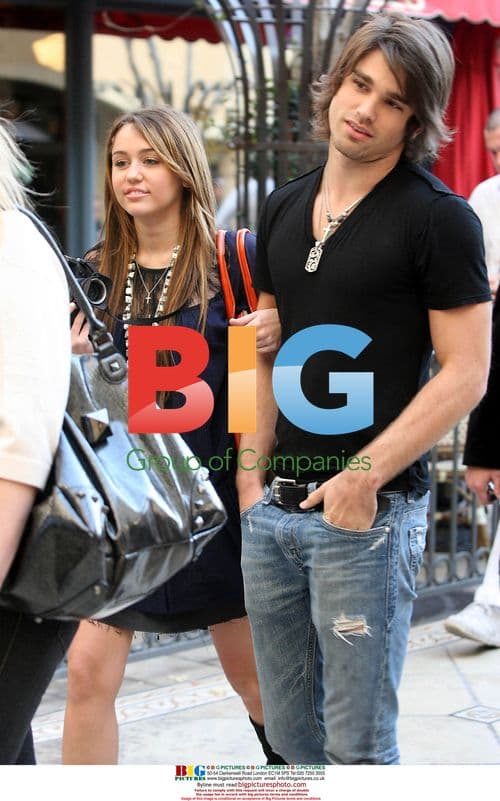 Miley Cyrus and Justin Gaston at The Grove