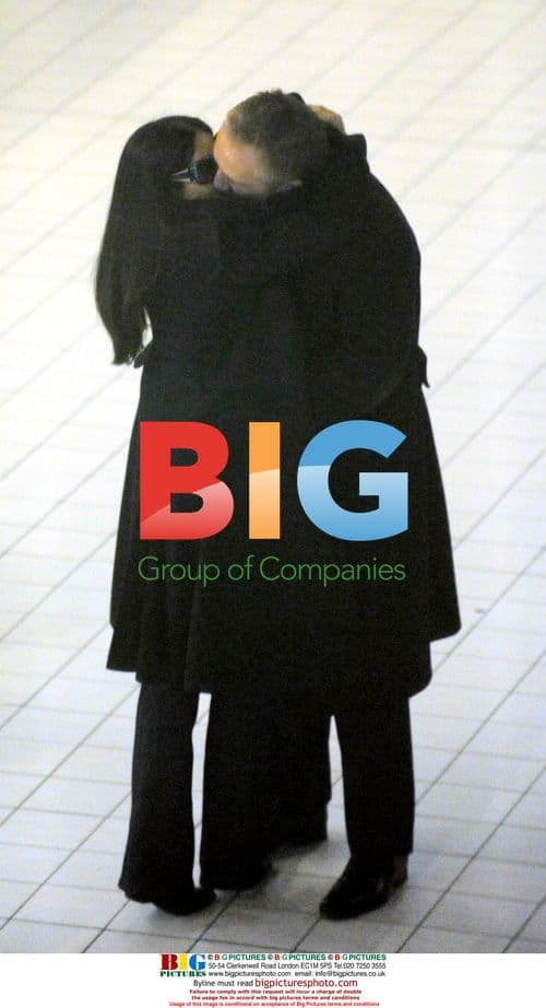 Millionnaire and Actress Embrace at Paris Airport