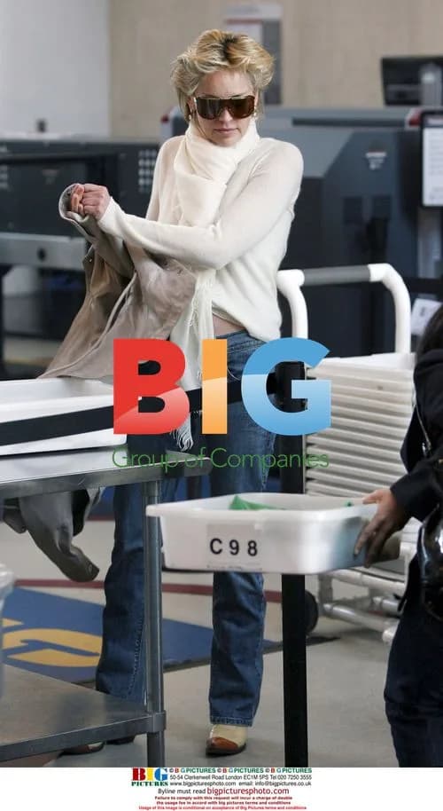 Sharon Stone Strips Down at LAX