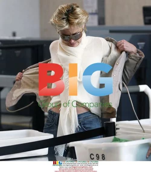 Sharon Stone Strips Down at LAX