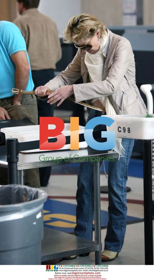 Sharon Stone strips down at LAX