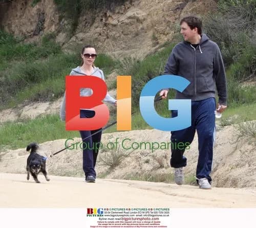 Christina Ricci and Owen Benjamin hiking with dog