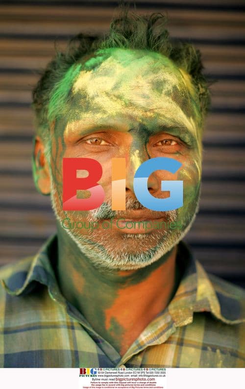 Man celebrates Holi festival in New Delhi