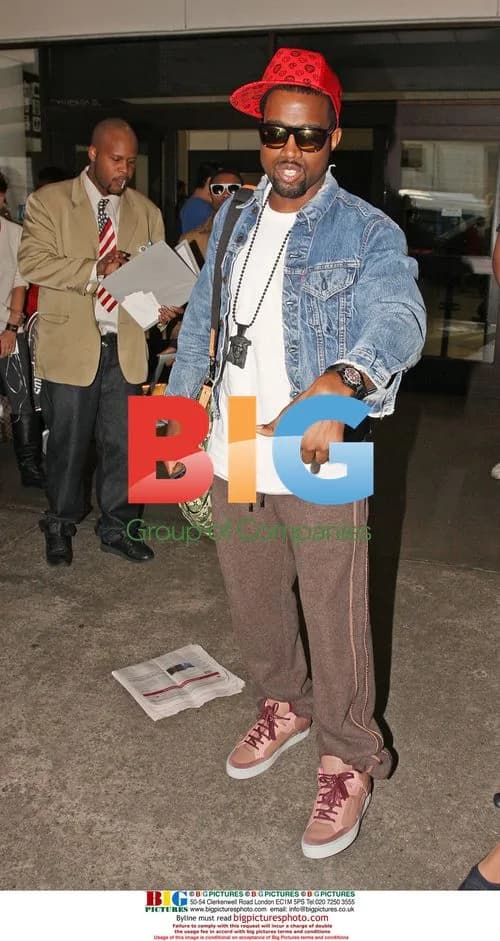 Kanye West Models Trainers at LAX