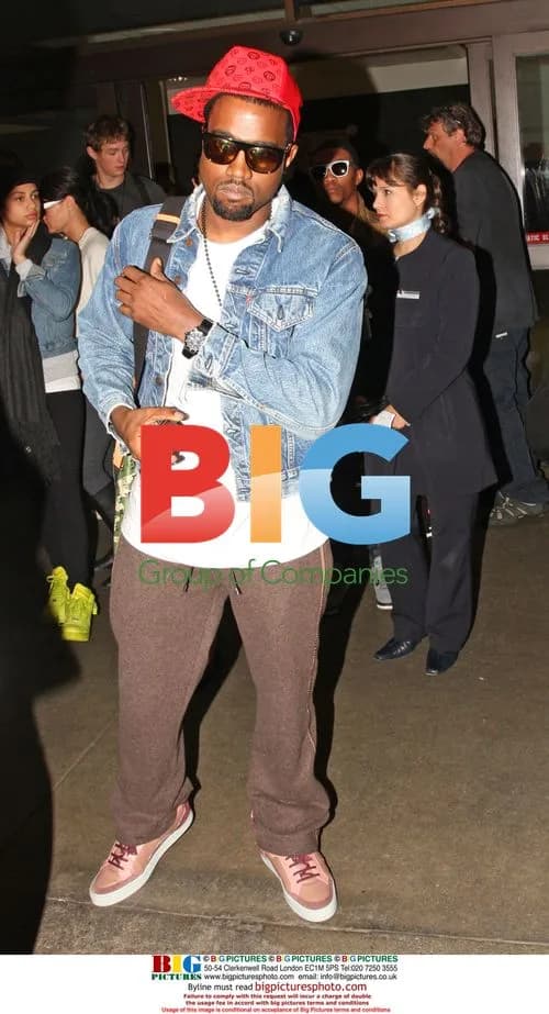 Kanye West Modeling Trainers at LAX
