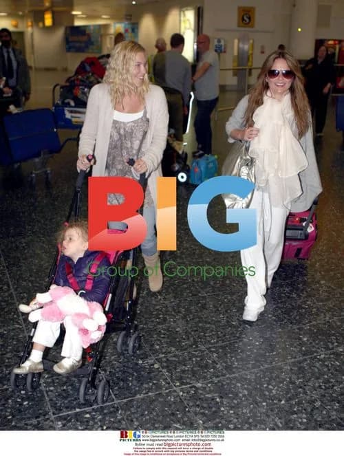 Geri Halliwell at London Airport with Daughter