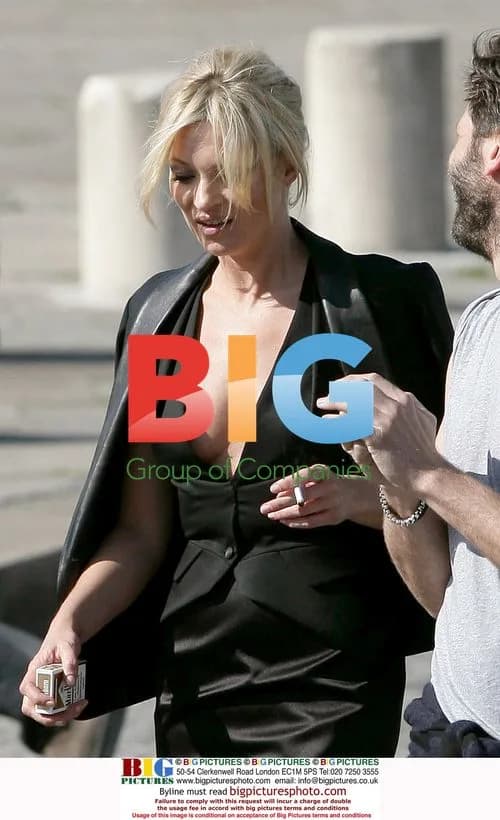 Kate Moss takes a cigarette break in Paris