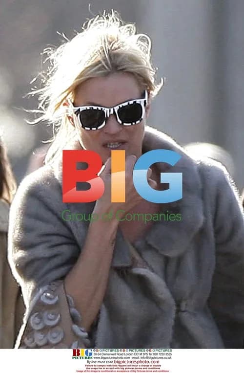 Kate Moss takes a cigarette break