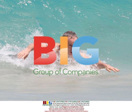 John McEnroe playing in the sea in the Caribbean