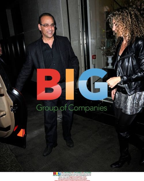 Theo Paphitis with mystery lady at the Ivy