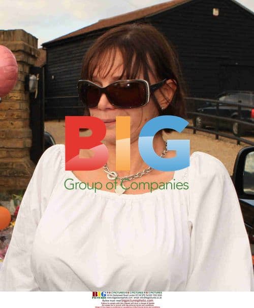 Jackiey Budden receives flowers after Jade Goody's death