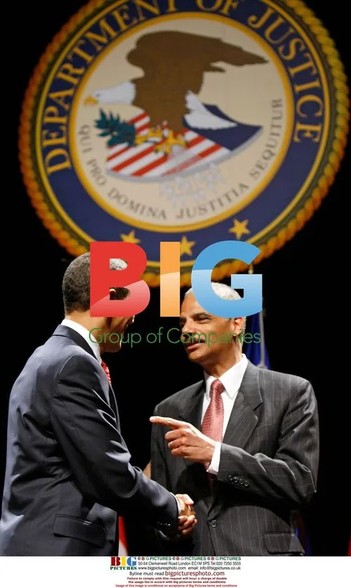 Obama Shakes Hands with Attorney General Holder