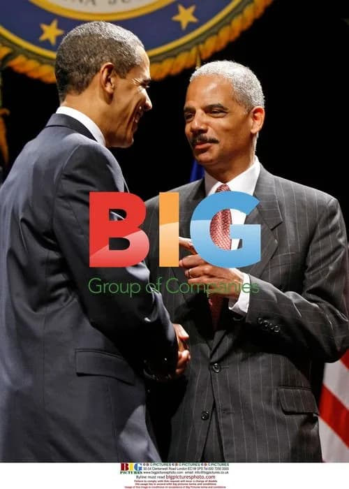 Obama Shakes Hands with Holder