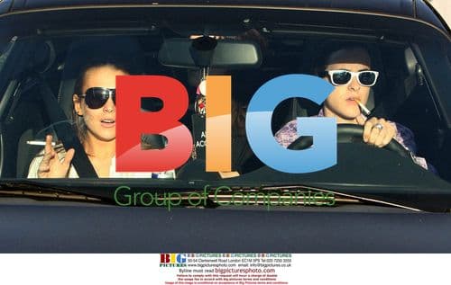 Lindsay Lohan and Samantha Ronson smoking after dinner