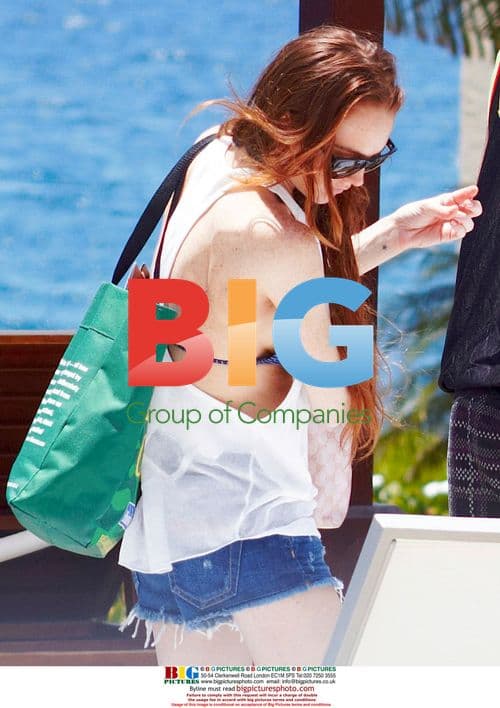 Lindsay Lohan relaxes poolside