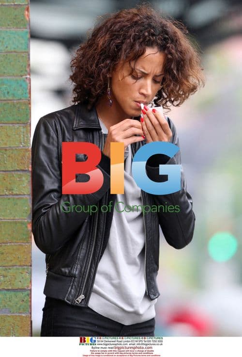 Noemie Lenoir steps out for a cigarette in NYC