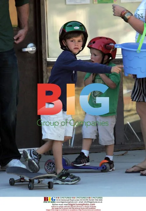 Romeo and Cruz Beckham play at park
