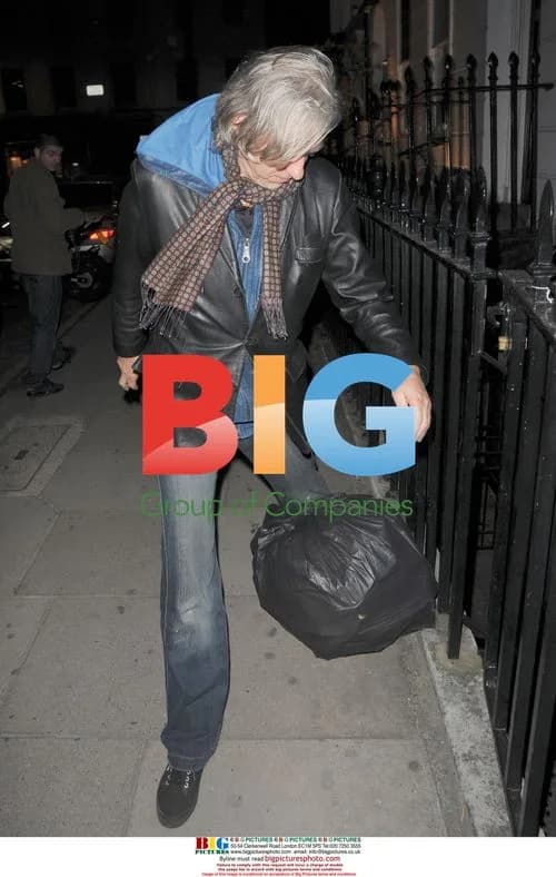 Bob Geldof trips on bin bag in London