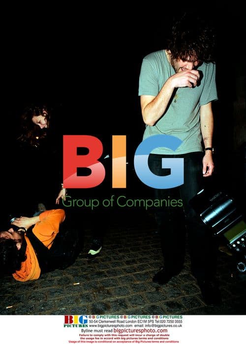 Jamie Reynolds from Klaxons laughs with photographer