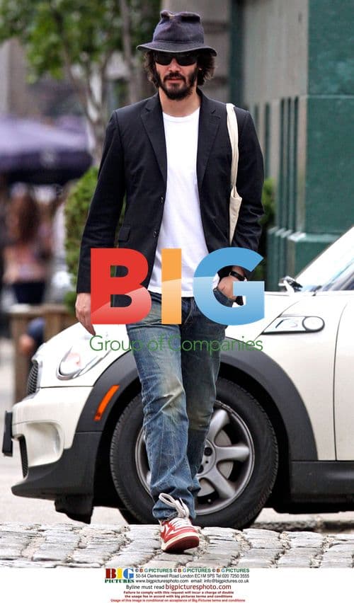 Keanu Reeves strolls with two women in East Village