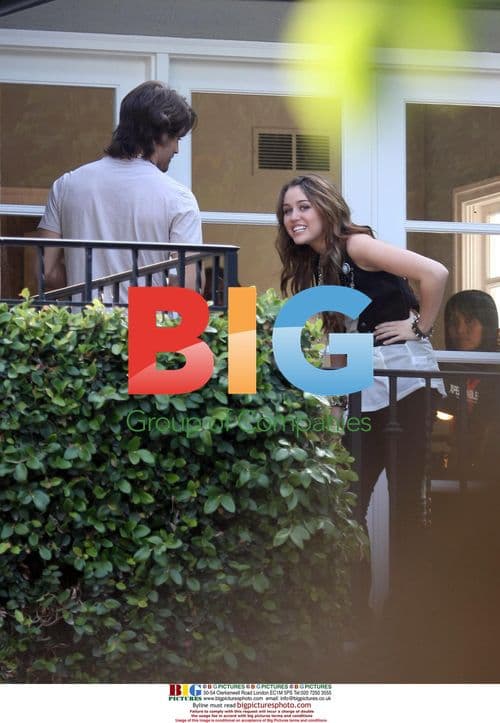 Miley Cyrus and Justin Gaston Hugging and Kissing