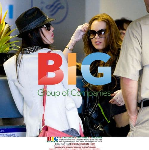 Lindsay Lohan and sister Ali depart LAX