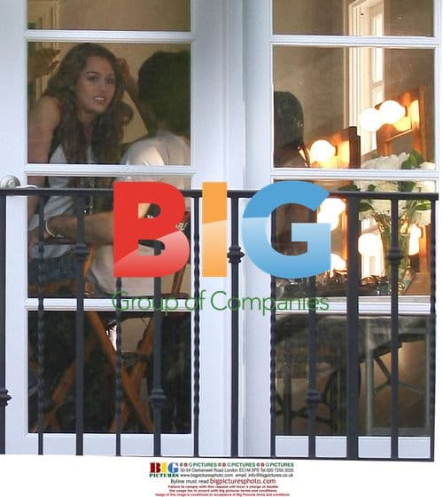 Miley Cyrus and Justin Gaston Intimate Moment