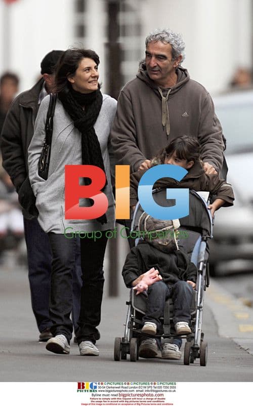 Raymond Domenech and Estelle Denis in Paris