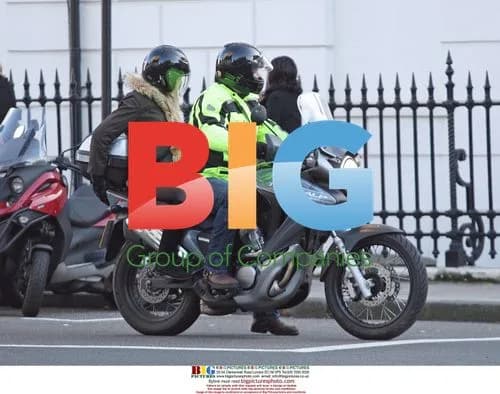 Adrian Chiles and mystery woman on motorbike