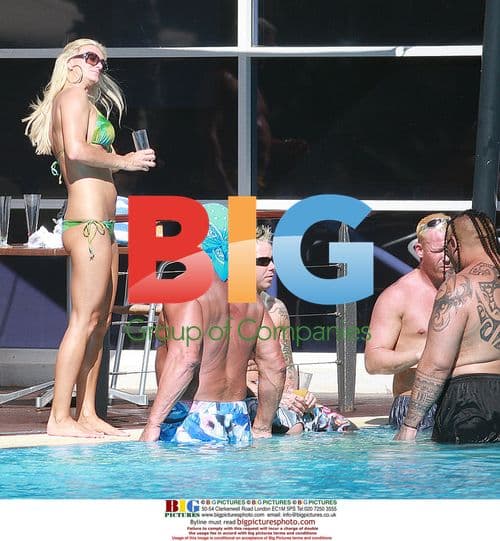 Hulk Hogan Relaxing with Girlfriend and Wrestlers