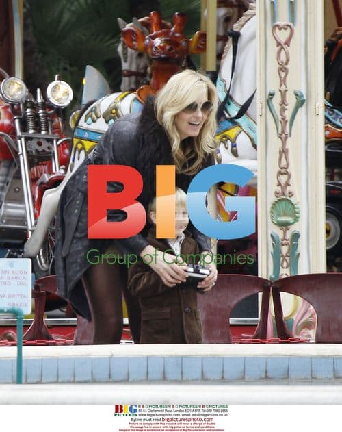 Penny Lancaster and son at Cannes funfair