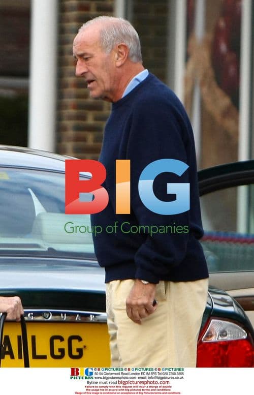 Len Goodman helps elderly lady with shopping