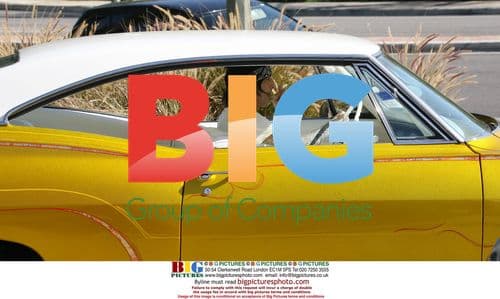 Tommy Lee Fueling Vintage Car