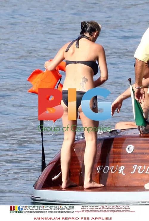 Liam Gallagher Sunbathes on Boat, Nicole Apprehensive in Sea